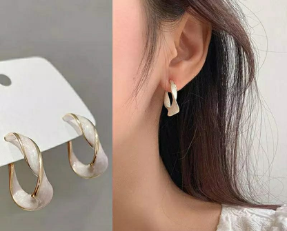 The Aurora Twist Hoop Earrings