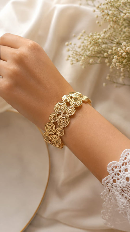 Elegant Gold Spiral Bracelet – Timeless Statement Piece