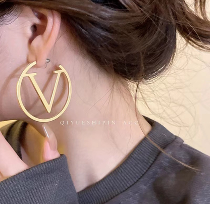 Gold “V” Logo Hoop Earrings – Modern Iconic Statement